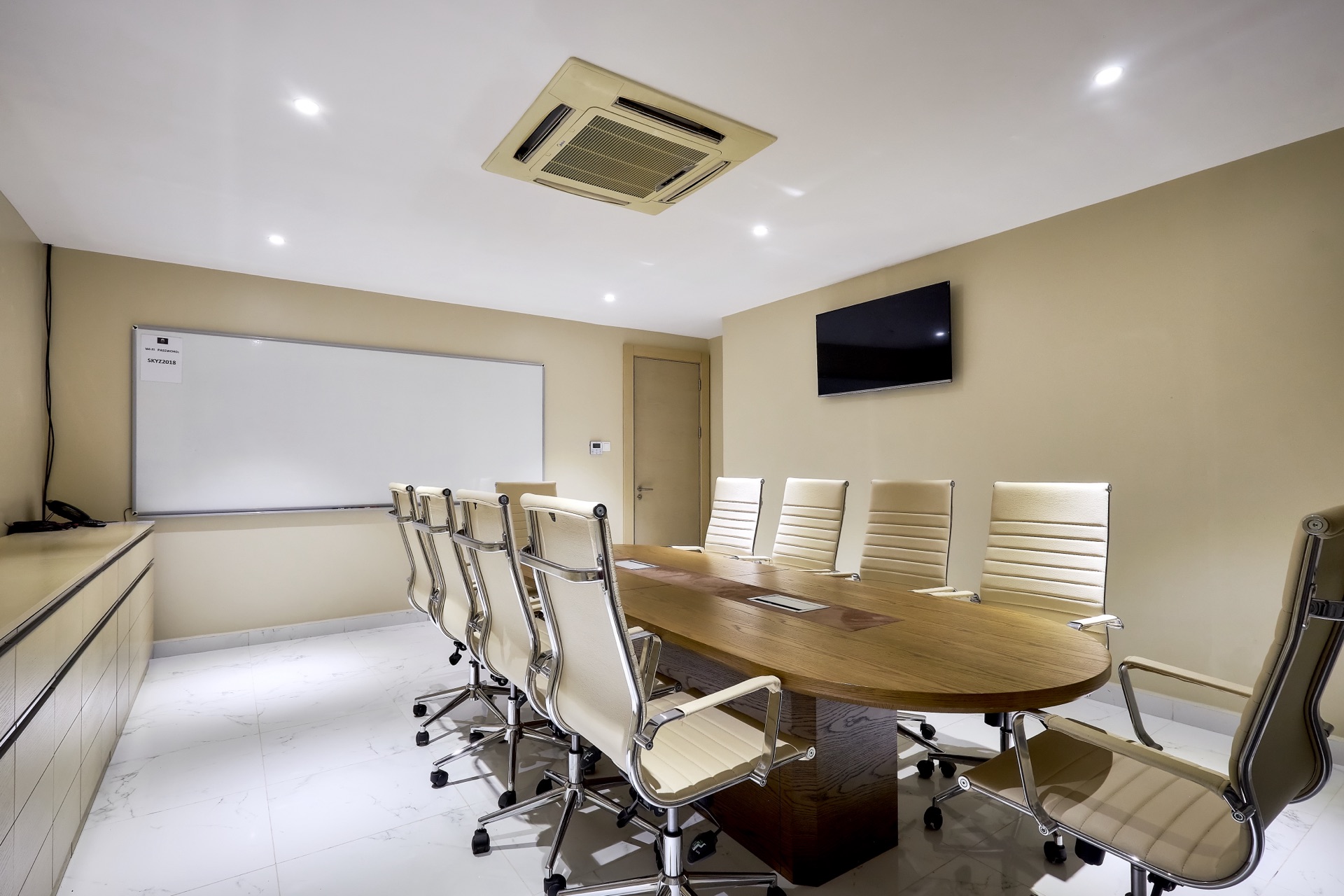 Executive boardroom with leather seating and natural light