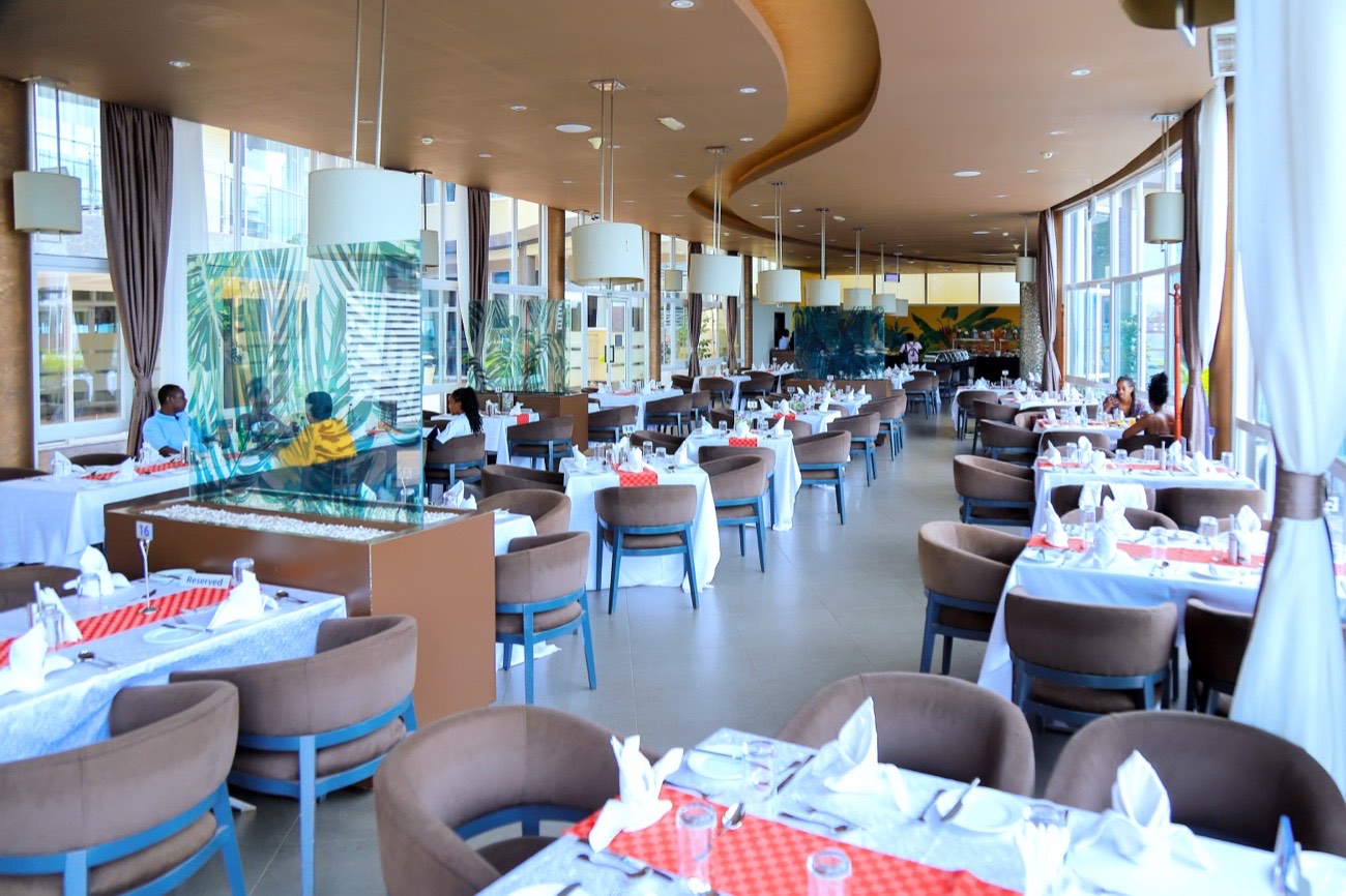 Chapter Two Restaurant set up for daytime buffet service, with blue chairs and red table runners