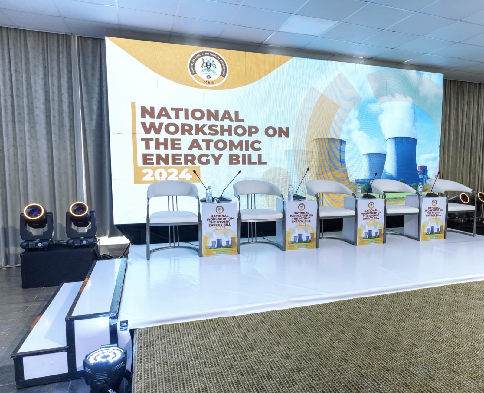 One of Skyz Hotel Kampala's conference halls staged for a corporate event with panel seating and a large screen backdrop
