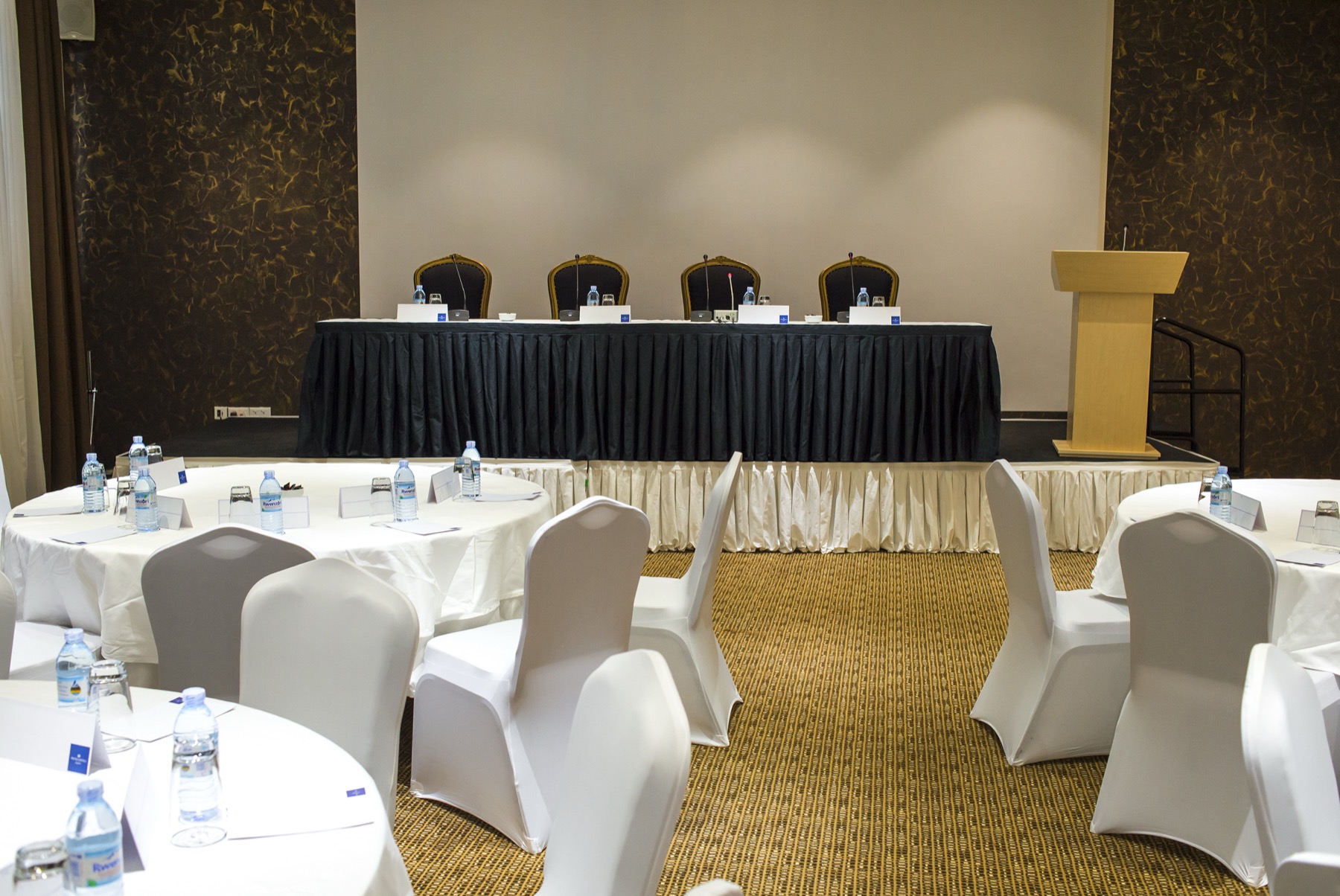 Nairobi Hall staged with a head table and podium for a conference