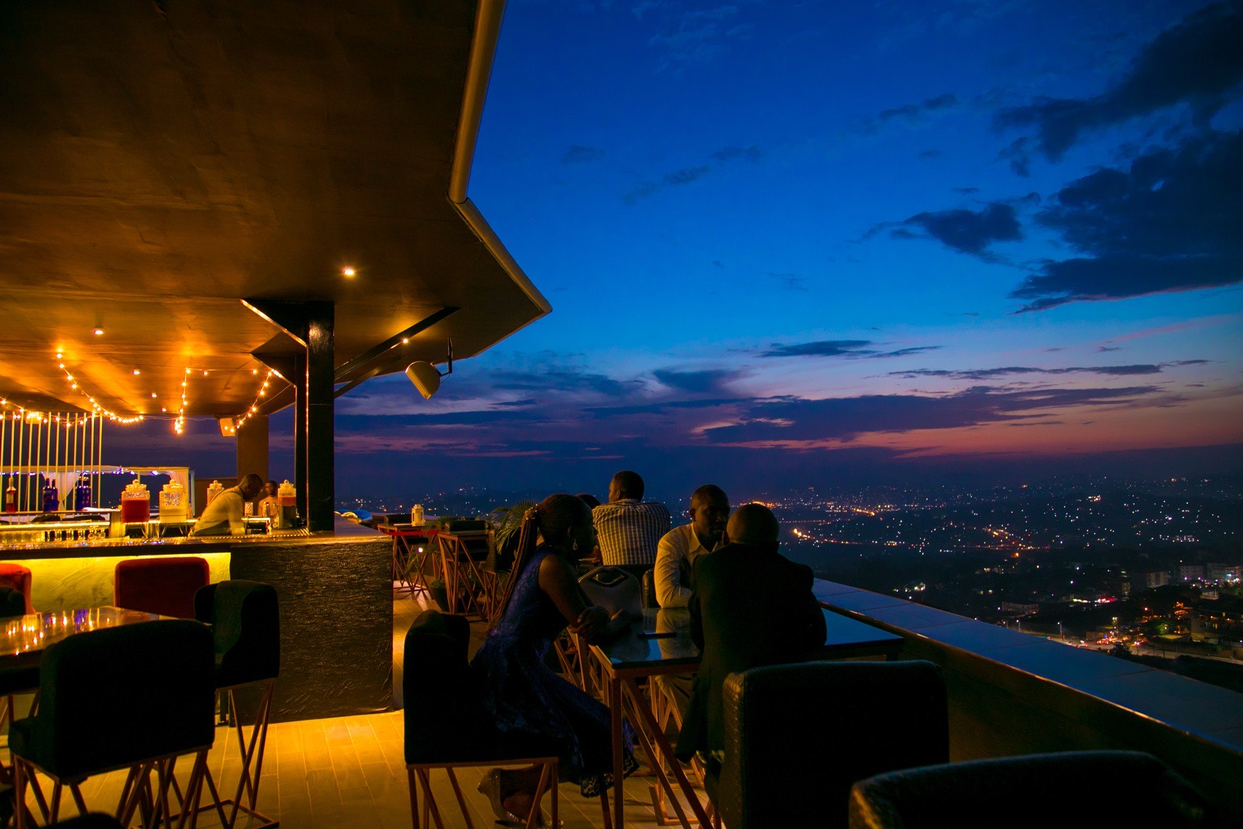 Coffee 2 Cocktails lounge with a curved ceiling and ambient blue lighting