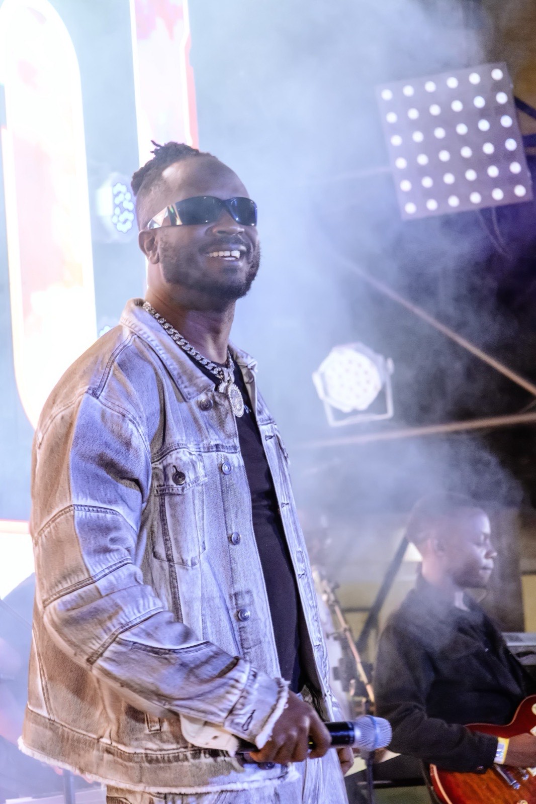 Bebe Cool smiling on stage at The Skyz Exclusive