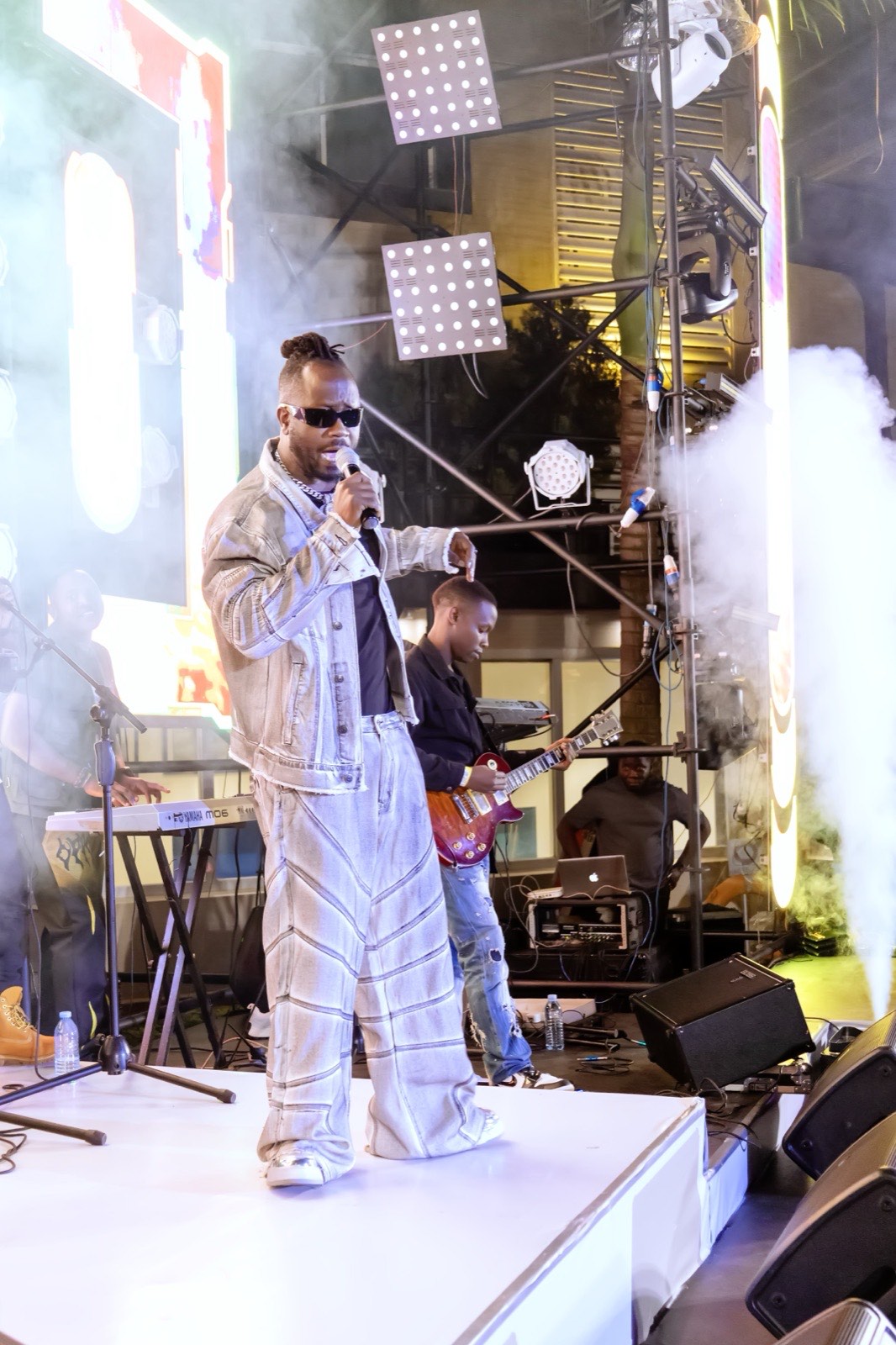 Bebe Cool performing with the live band behind him at The Skyz Exclusive