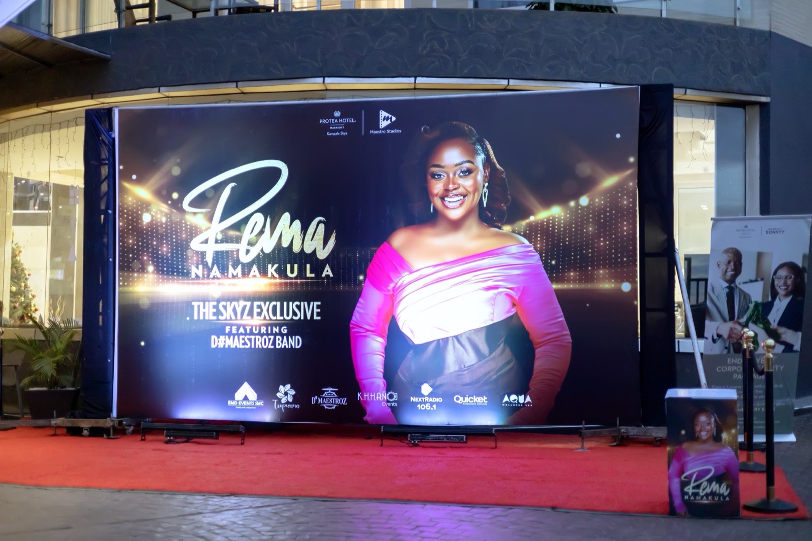 Rema Namakula on stage under coloured lights at The Skyz Exclusive
